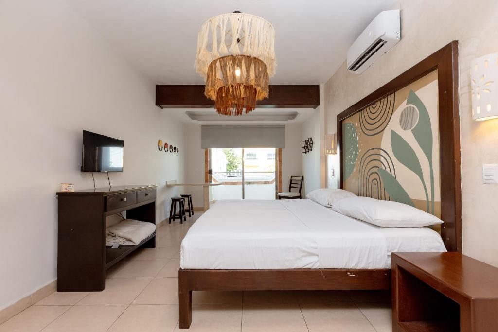 Cama ou camas em um quarto em Hotel Kinich