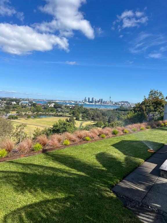 a view of the city from a park at The City Cottage in Auckland