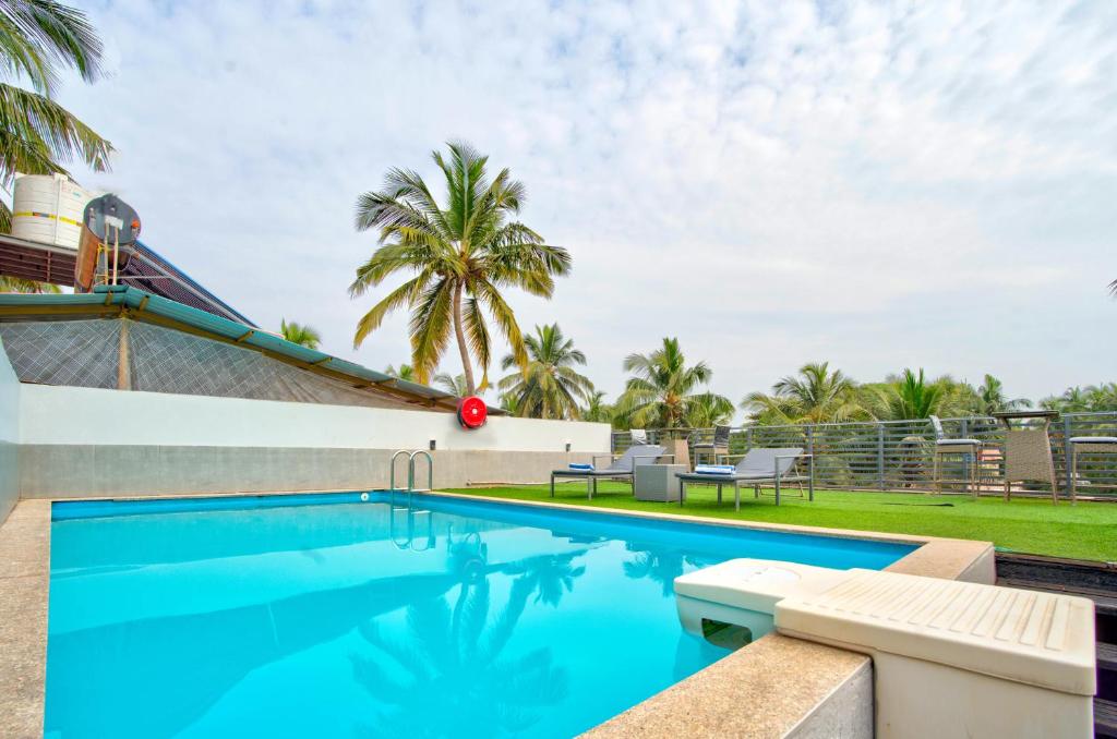 Bazén v ubytování The Beach House Candolim nebo v jeho okolí