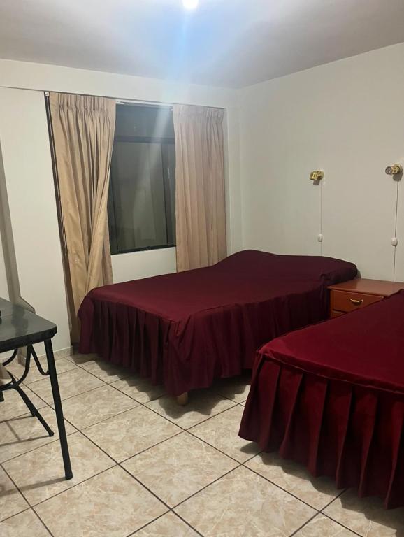Postel nebo postele na pokoji v ubytování Mi casa Tacna
