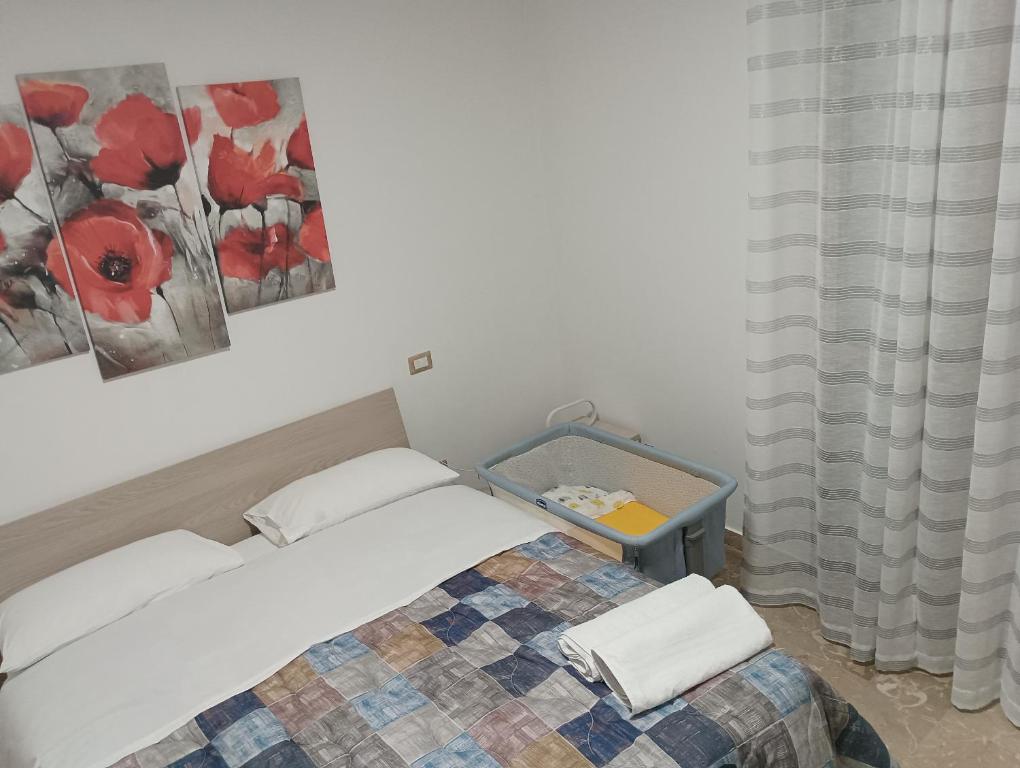 Postel nebo postele na pokoji v ubytování A casa di Elena e Francesco