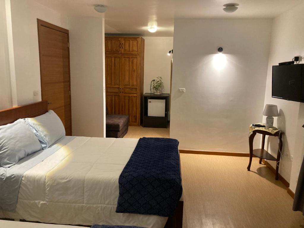 Postel nebo postele na pokoji v ubytování Apricot Hotel