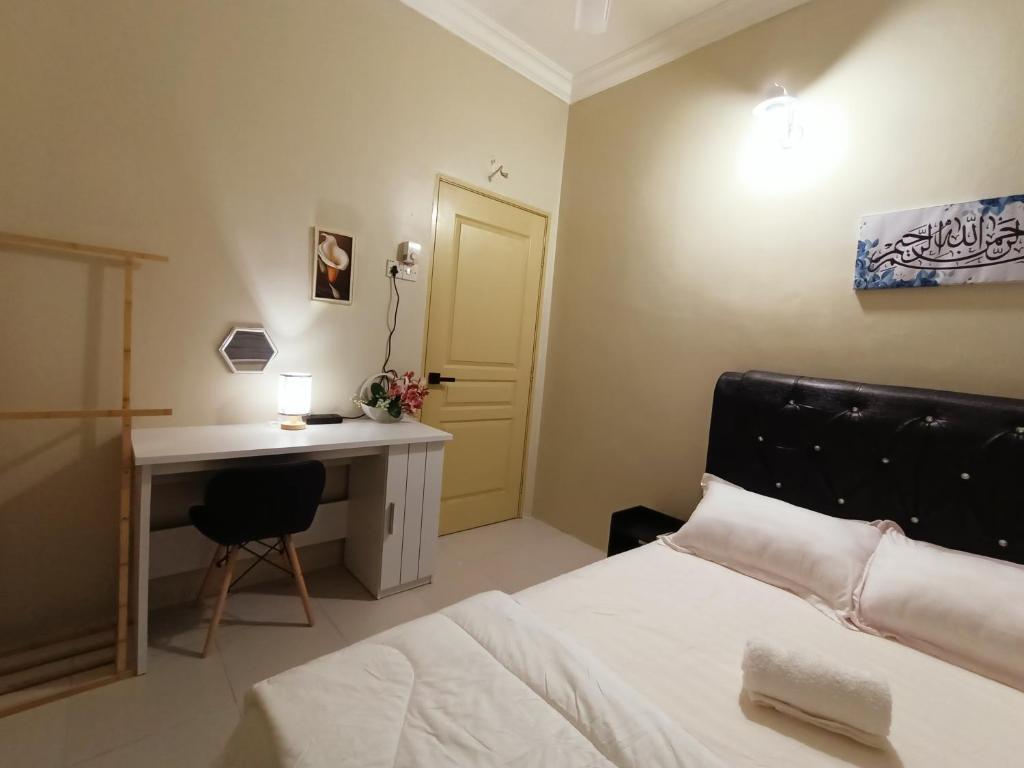 Postel nebo postele na pokoji v ubytování Inap Kluster Height , Kuala Kangsar
