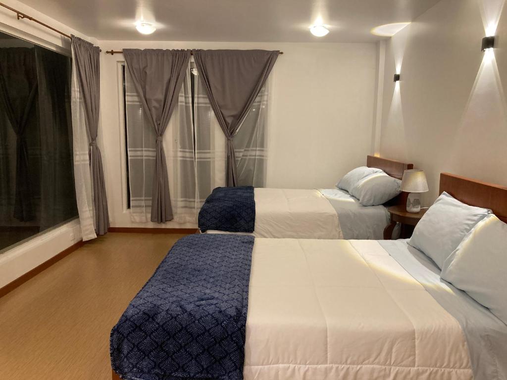 Postel nebo postele na pokoji v ubytování Apricot Hotel