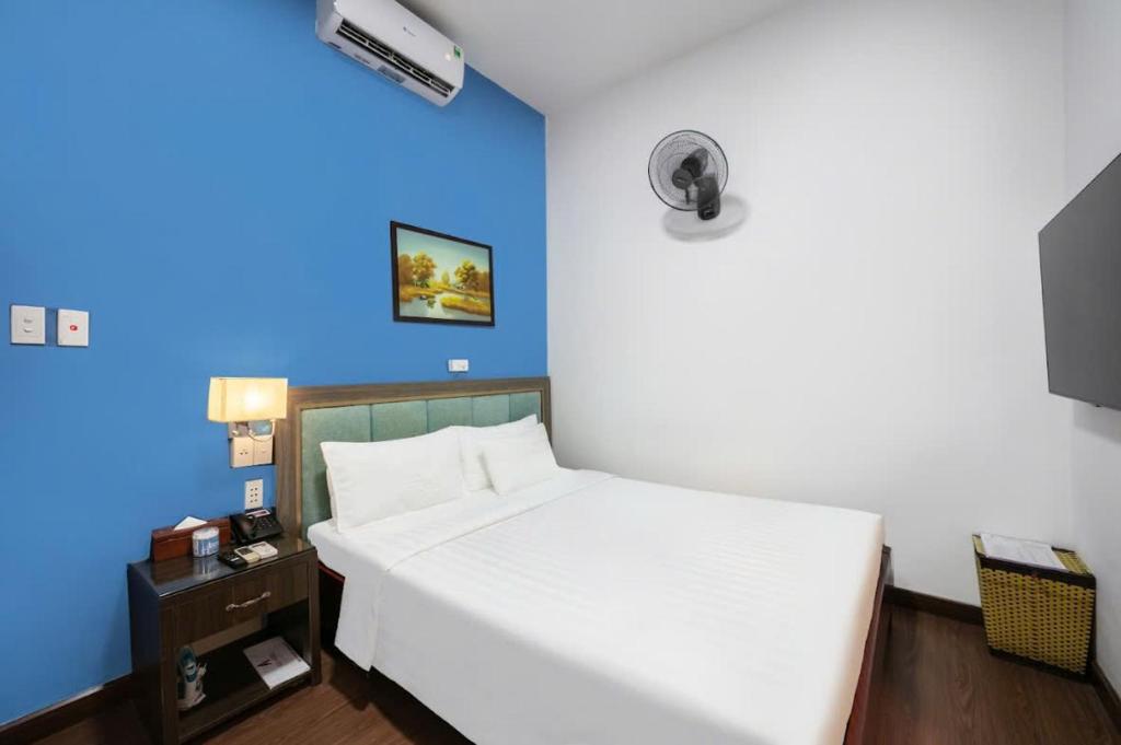 Postel nebo postele na pokoji v ubytování A25 Hotel - Hoàng Quốc Việt