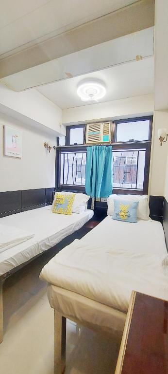 Postel nebo postele na pokoji v ubytování 吉祥賓館 Fortune Inn