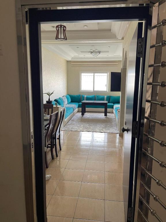 a living room with a couch and a table at luxury apartment in Agadir