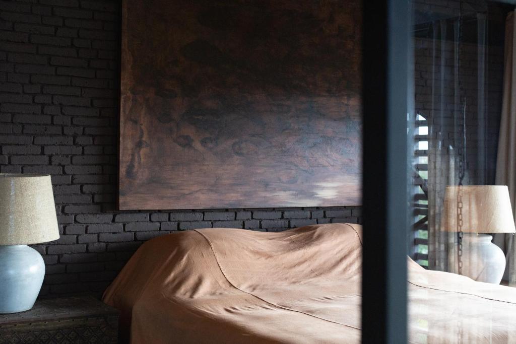 Postel nebo postele na pokoji v ubytování The Bohemian Bali, a Member of Design Hotels