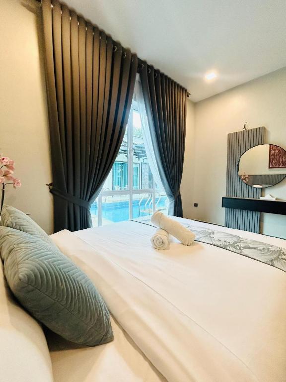 Postel nebo postele na pokoji v ubytování Tijami Villa & Resort