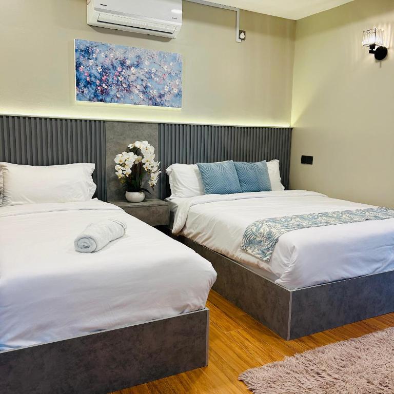 Postel nebo postele na pokoji v ubytování Tijami Villa & Resort