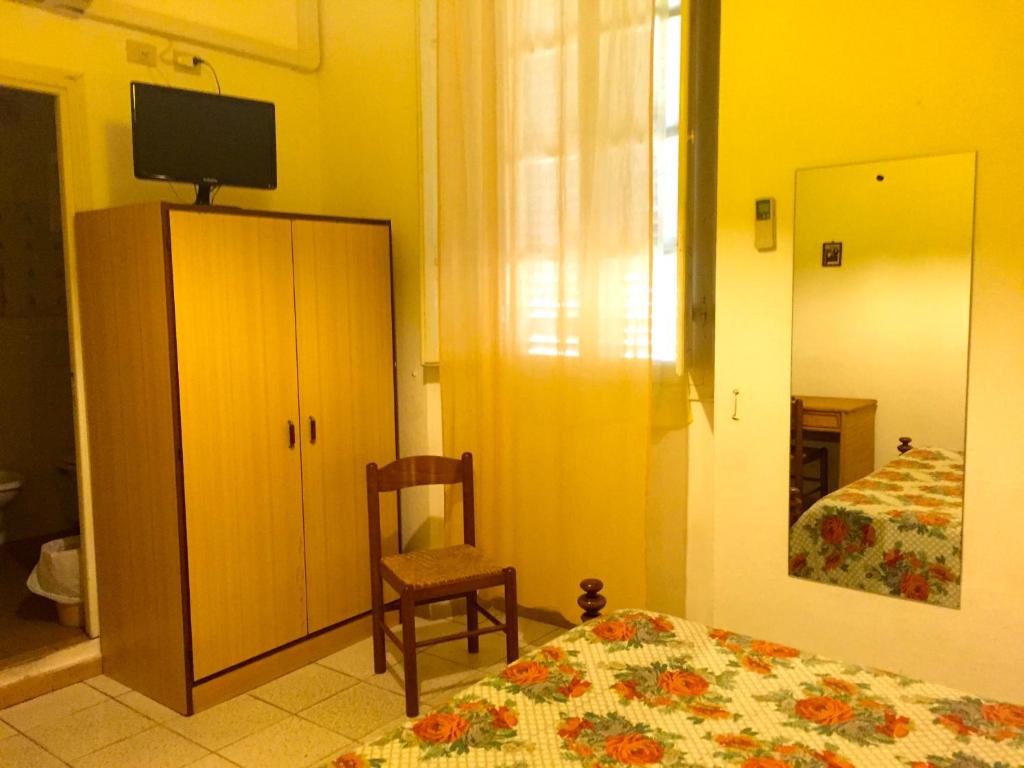 Postel nebo postele na pokoji v ubytování Albergo Ape Elbana