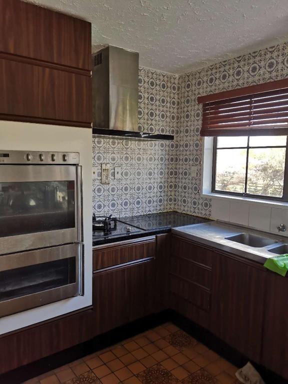 Kuchyň nebo kuchyňský kout v ubytování Cozy 安逸舒适小屋