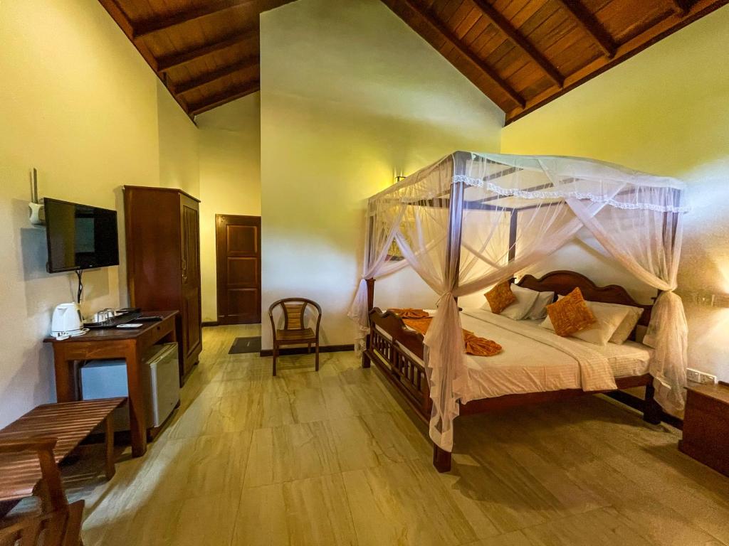 Postel nebo postele na pokoji v ubytování Heli's Villa Unawatuna