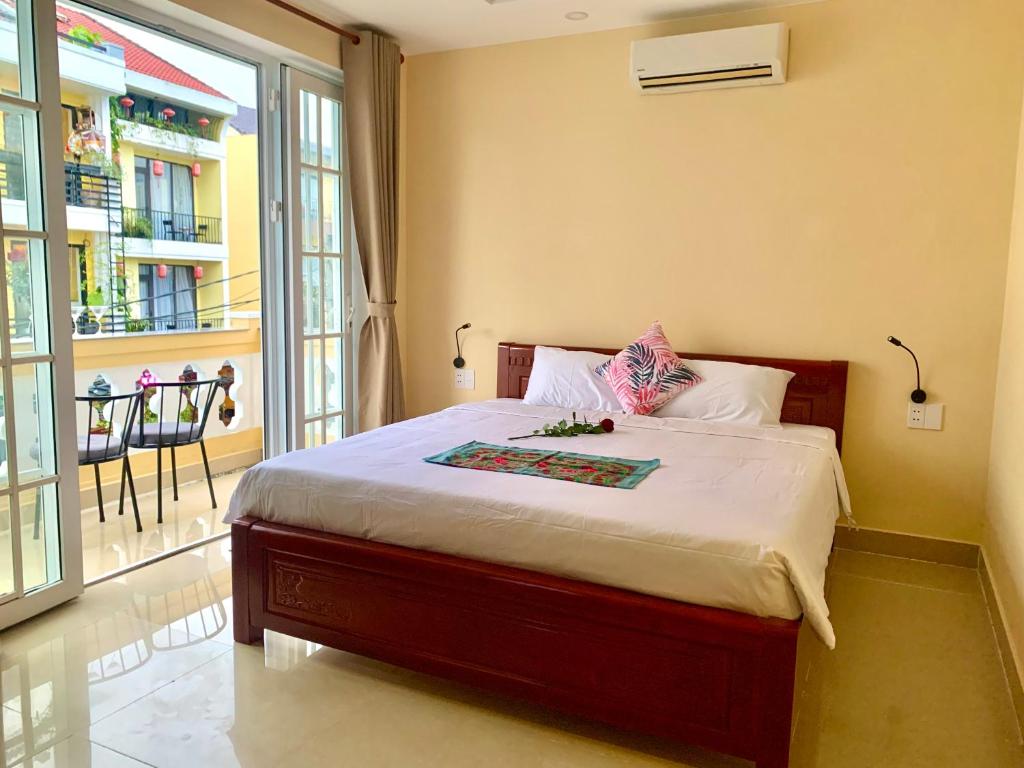 Giường trong phòng chung tại Aman Riverside Hotel