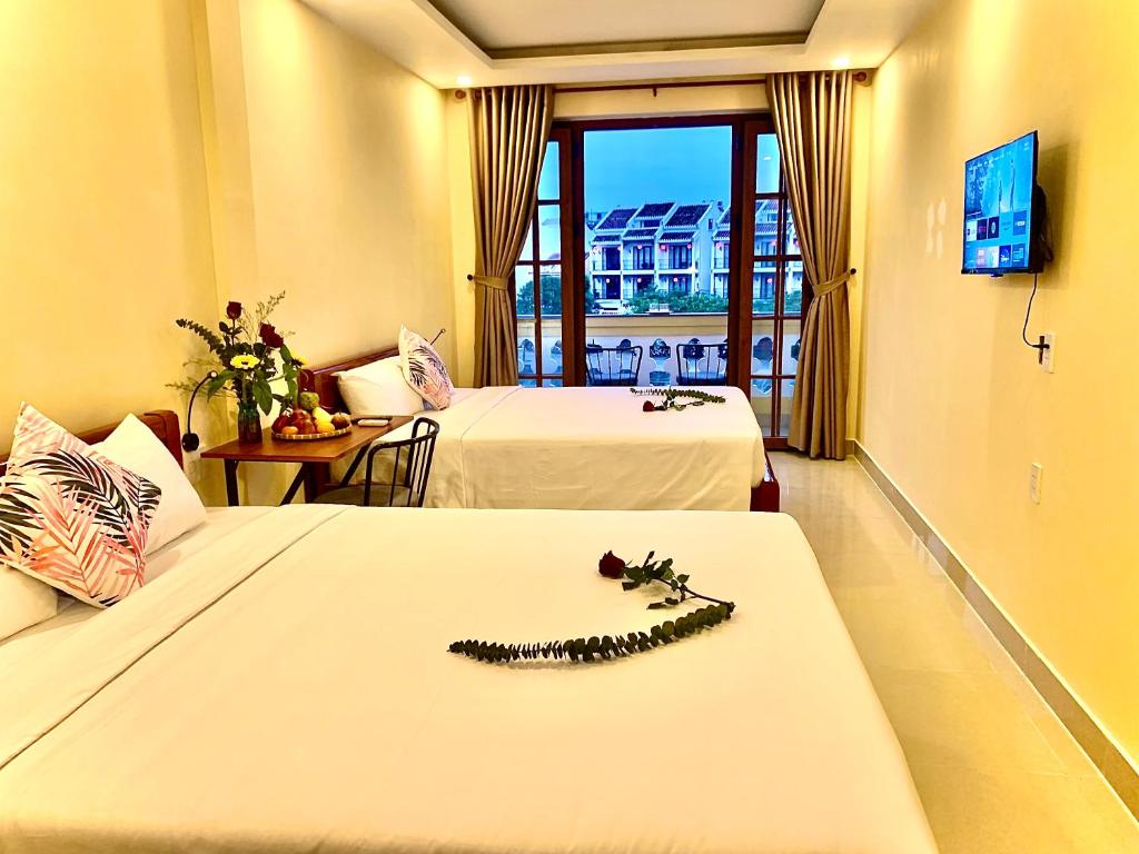 TV a/nebo společenská místnost v ubytování Aman Riverside Hotel