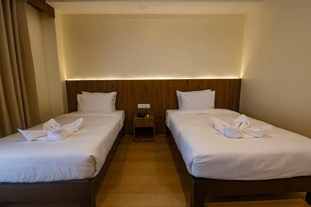 Postel nebo postele na pokoji v ubytování Hotel Dashain