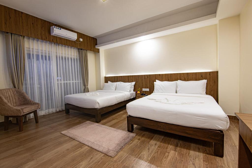 Postel nebo postele na pokoji v ubytování Hotel Dashain