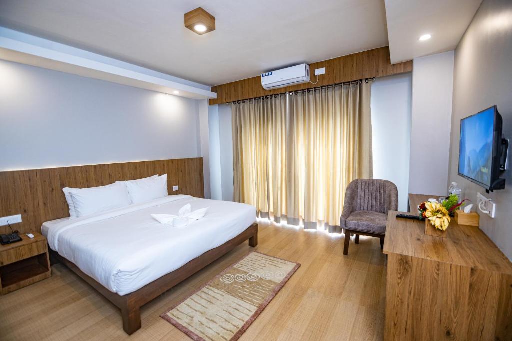 Postel nebo postele na pokoji v ubytování Hotel Dashain