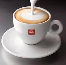 a cup of coffee sitting on a white plate at Hatton's of Garadice in Garadice