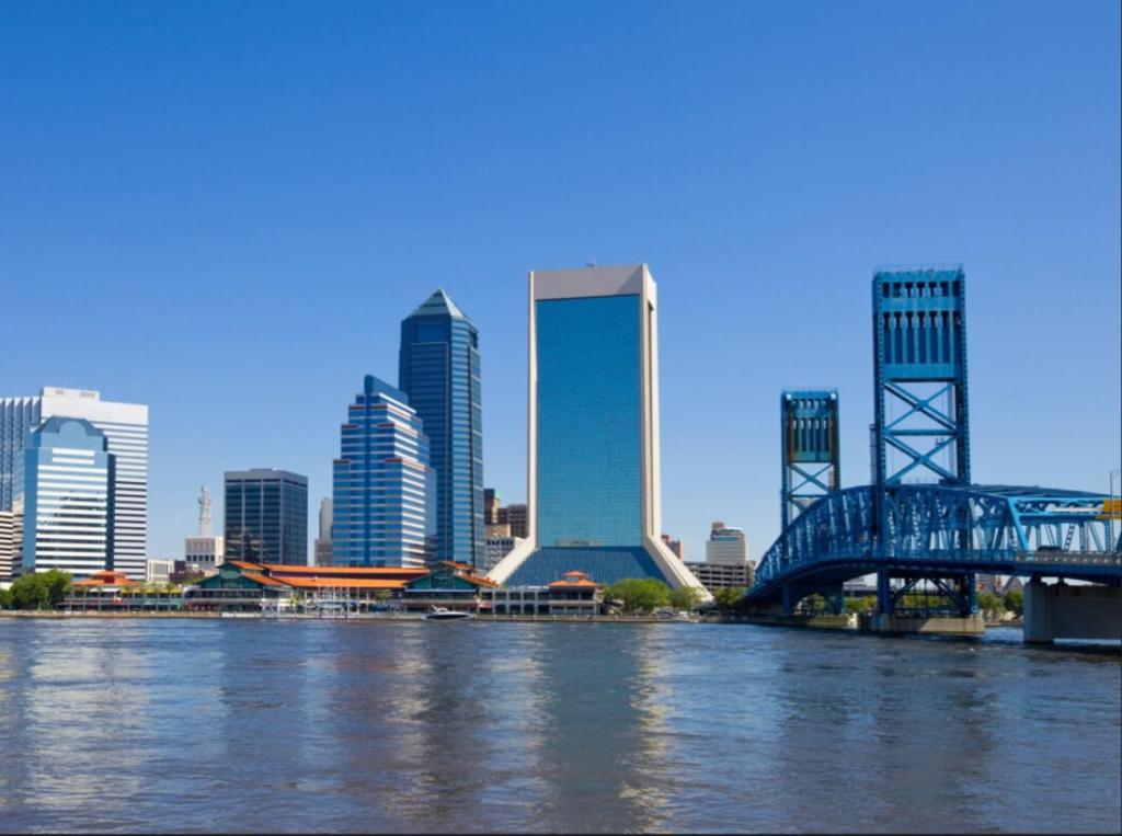 a view of a city with a bridge over a river at Cozy House St Johns Bluff in Jacksonville