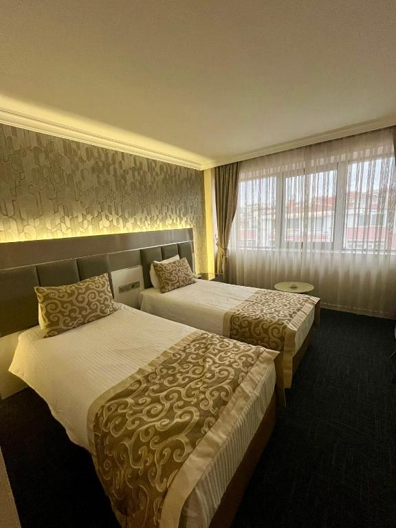 Postel nebo postele na pokoji v ubytování Aldino Hotel & Spa