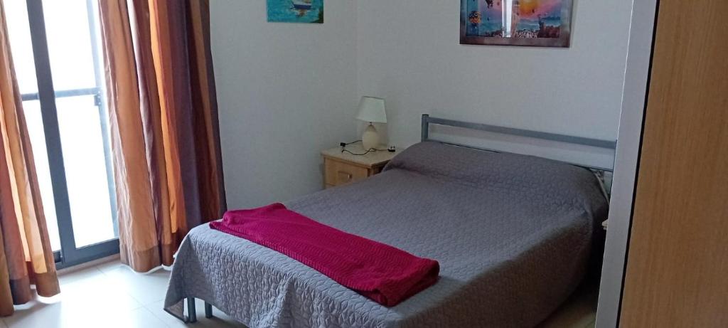 Postel nebo postele na pokoji v ubytování LA court in Marsascala