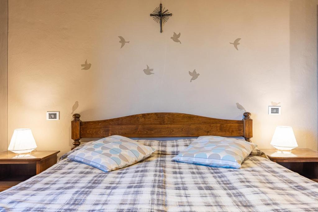 Postel nebo postele na pokoji v ubytování Il Gugnolo - Casale in Val d'Orcia