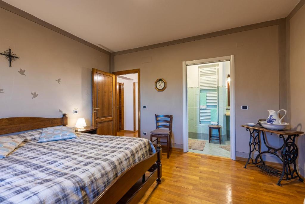 Postel nebo postele na pokoji v ubytování Il Gugnolo - Casale in Val d'Orcia