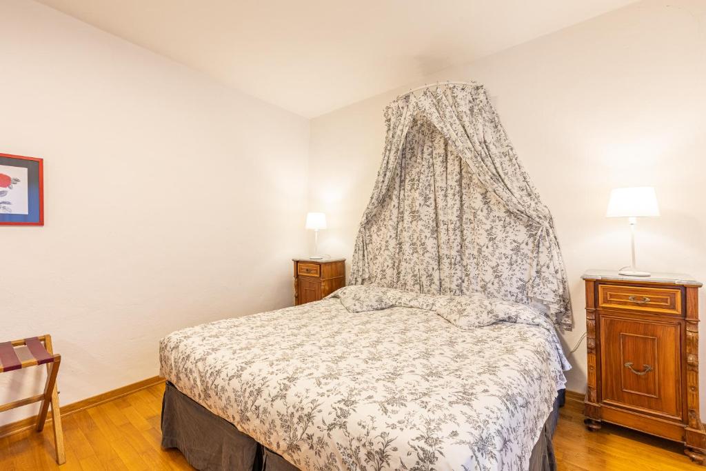 Postel nebo postele na pokoji v ubytování Il Gugnolo - Casale in Val d'Orcia