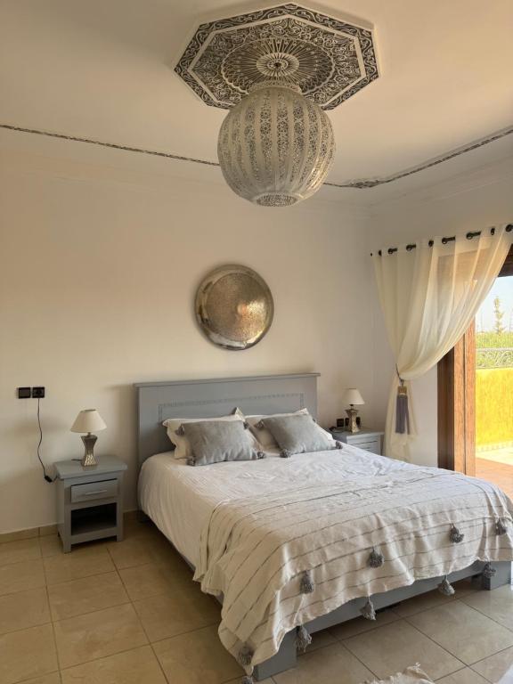 Postel nebo postele na pokoji v ubytování Maison Jannate Louise