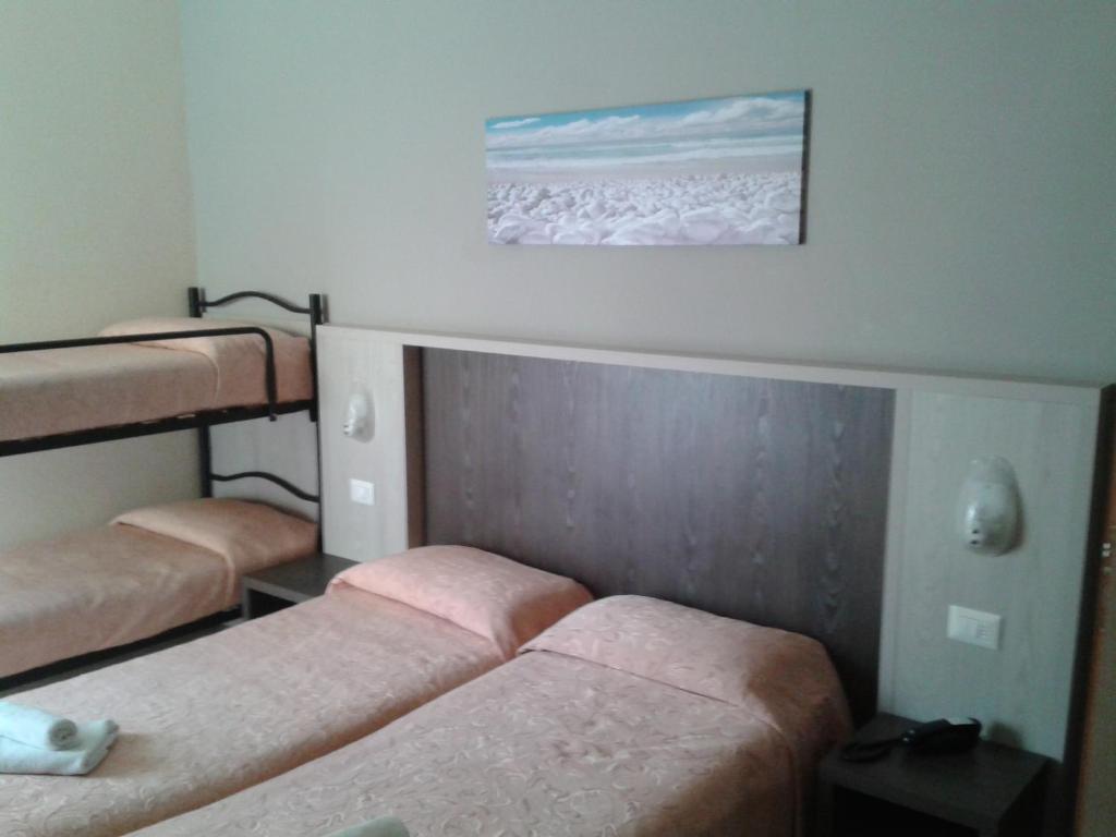 Postel nebo postele na pokoji v ubytování Hotel Senyor