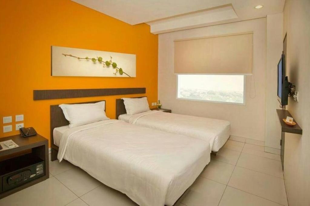 Postel nebo postele na pokoji v ubytování V Hotel Tebet
