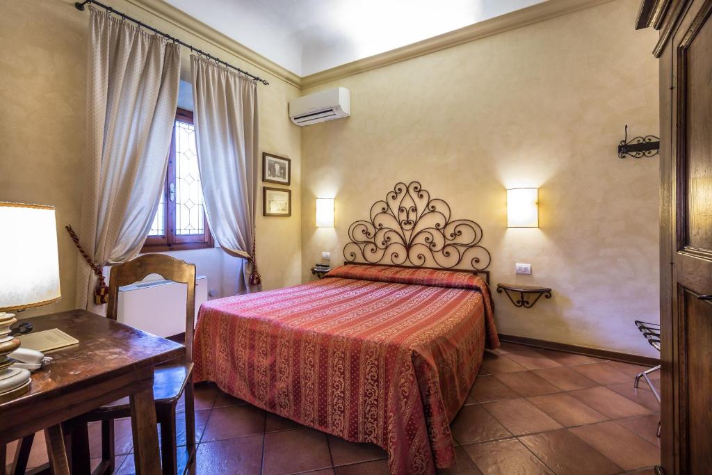 Postel nebo postele na pokoji v ubytování Hotel Mario's
