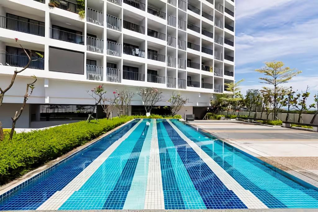a swimming pool in front of a building at The Landmark Penang in Tanjong Tokong