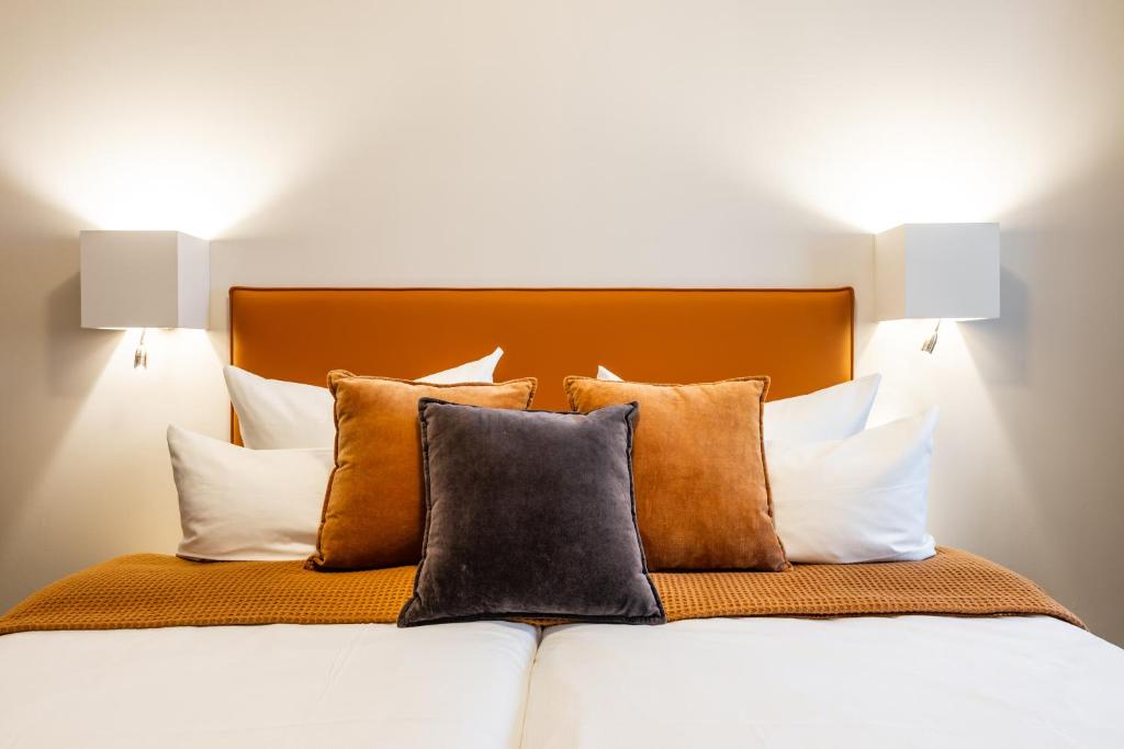 Postel nebo postele na pokoji v ubytování Hotel Goldene Steig