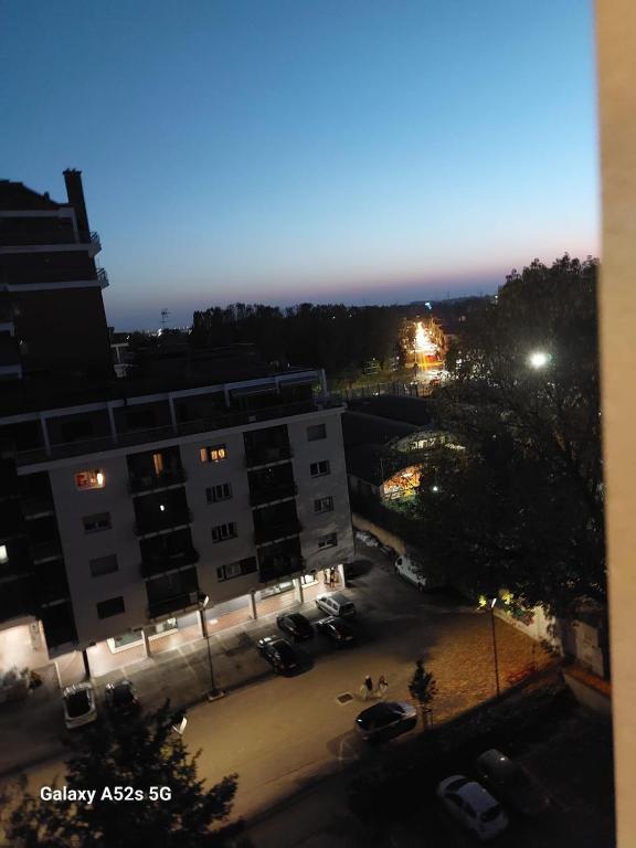 a view of a parking lot in a city at night at #Punto FM 7# in Marghera