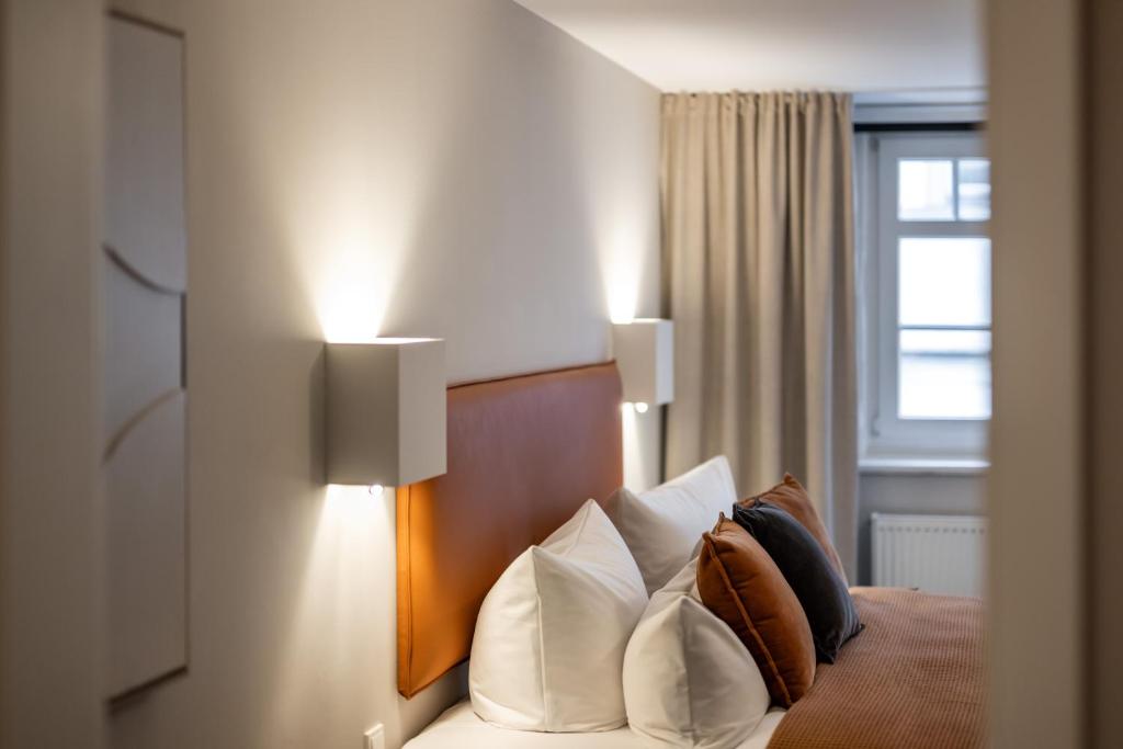 Postel nebo postele na pokoji v ubytování Hotel Goldene Steig