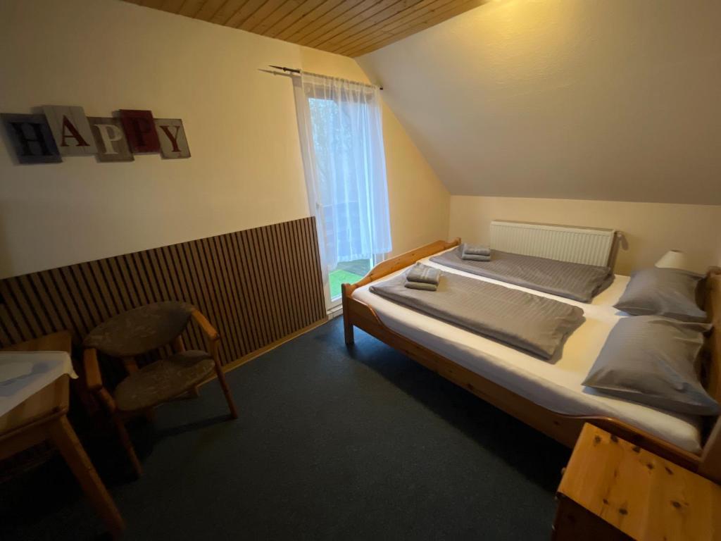 Postel nebo postele na pokoji v ubytování Hotel Mühleneck