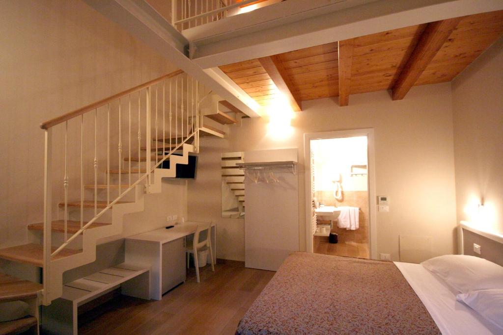Postel nebo postele na pokoji v ubytování Agriturismo B&B Vista Parco