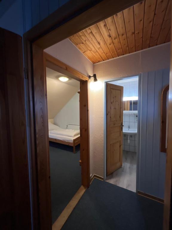 Postel nebo postele na pokoji v ubytování Hotel Mühleneck