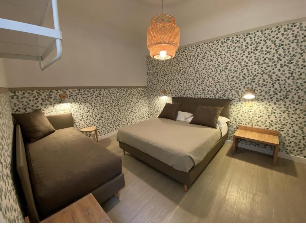 Postel nebo postele na pokoji v ubytování Hotel Nella