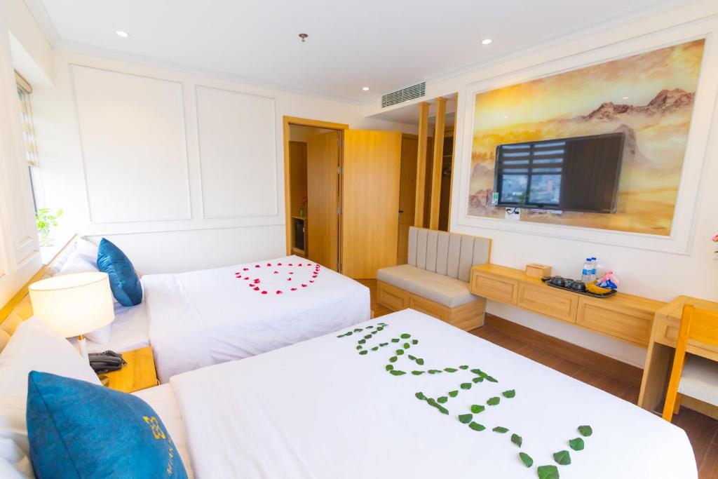 Katil atau katil-katil dalam bilik di MiAn Hotel Danang - Infinity Pool