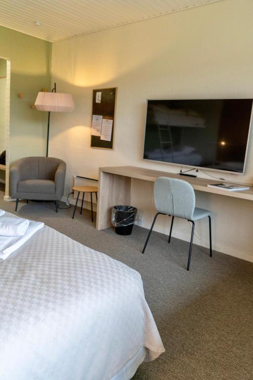 Postel nebo postele na pokoji v ubytování Strandhotel Klitrosen