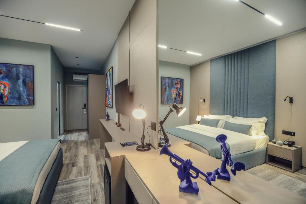 Postel nebo postele na pokoji v ubytování Hotel Dirista