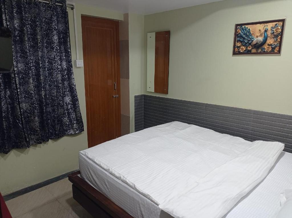 Postel nebo postele na pokoji v ubytování Elevate Horizon Hotel
