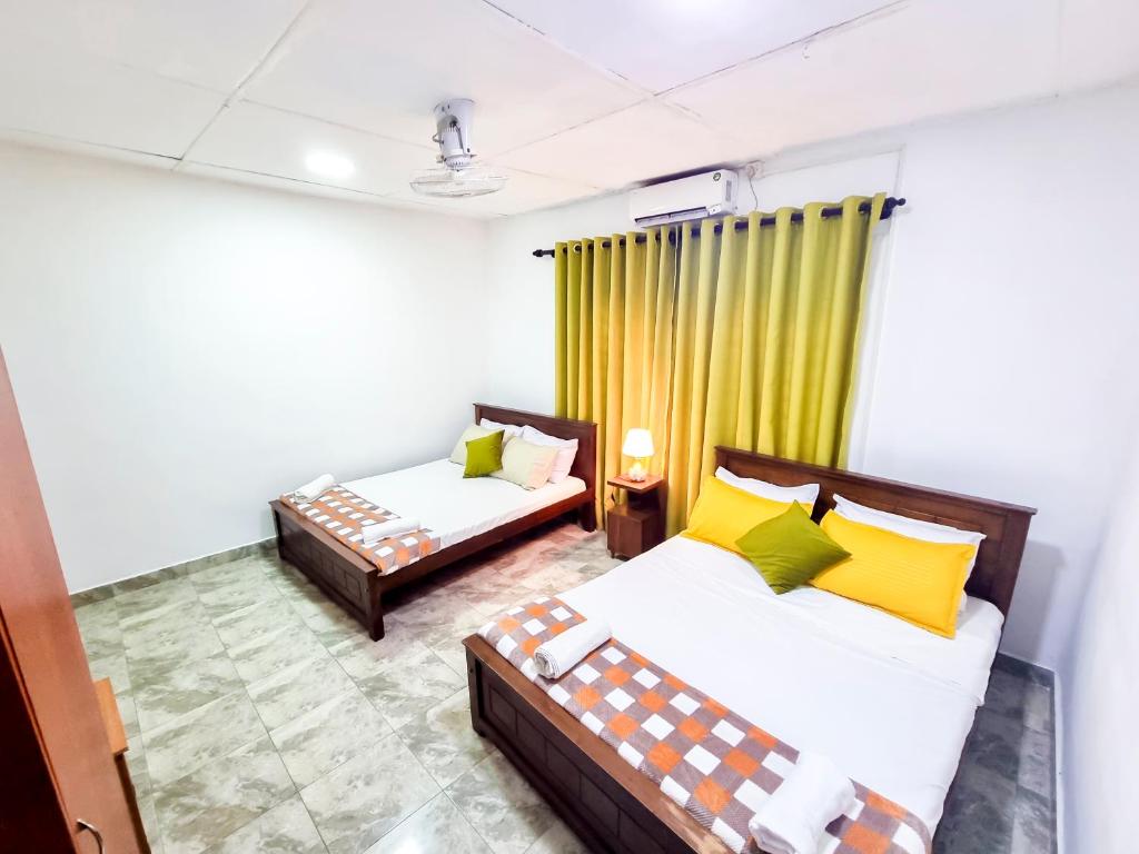 HOSTEL KATUNAYAKE At COLOMBO AIRPORT TRANSITにあるベッド
