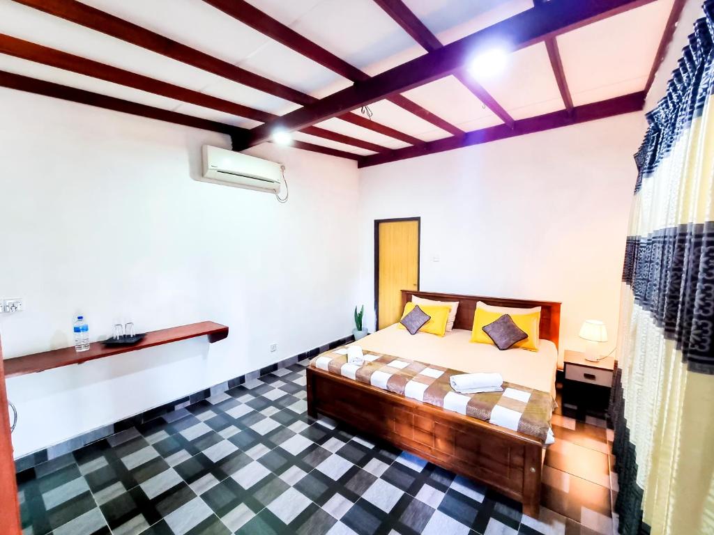 HOSTEL KATUNAYAKE At COLOMBO AIRPORT TRANSITにあるベッド