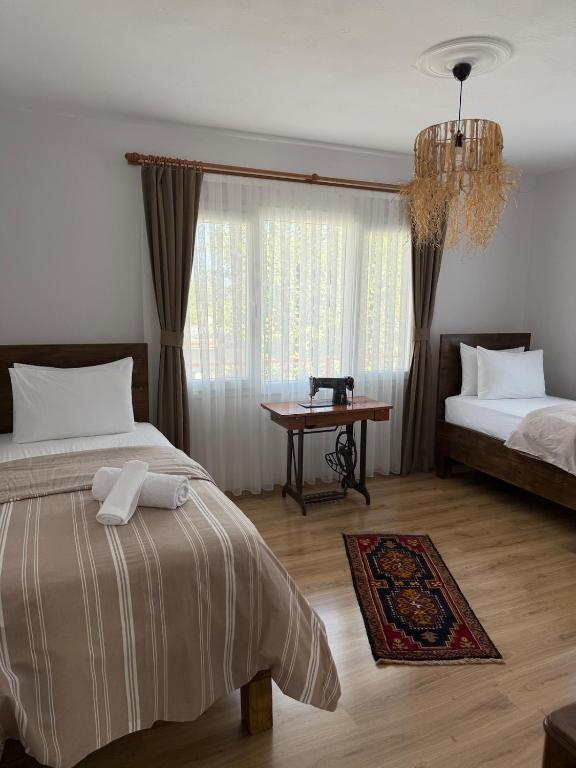 Postel nebo postele na pokoji v ubytování Urla The Orange House