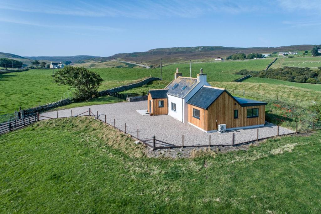 an overhead view of a house in a field at Armadale Farm Cottage in Armadale