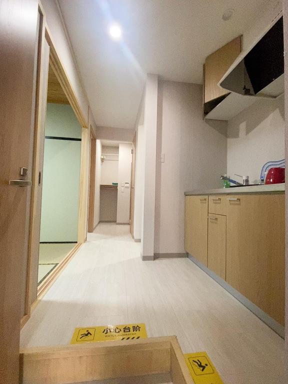 Kuchyň nebo kuchyňský kout v ubytování 大阪历史文化街区日式酒店 体验纯正和风生活 机场地铁直达
